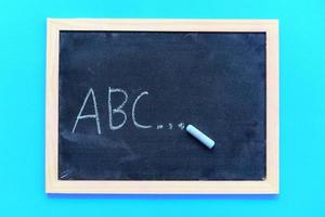 Blackboard texture chalk draw and write A B C for education in school chalkboard background Blackboard dark or chalkboard with horizontal and banner , selective focus photo