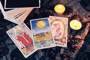 Tarot cards by candlelight on dark background fortune card prophecy gypsy card for fortune teller reading future photo