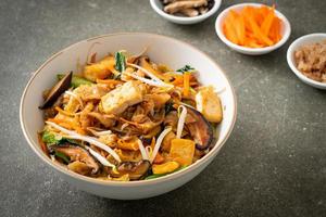 stir-fried noodles with tofu and vegetables photo