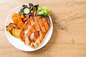 grilled salmon steak fillet with vegetable photo