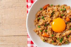 salmon fried rice with pickled egg on top photo