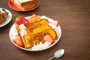 french toast with fresh strawberry and whipping cream photo