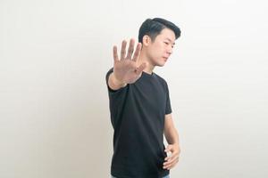 portrait young Asian with stop hand sign photo