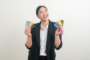 Asian woman holding credit card with white background photo