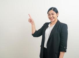 Asian woman with hand pointing on white background photo