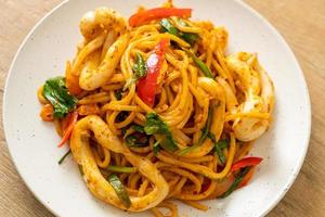 stir-fried spaghetti with salted egg and squid photo