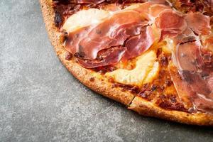 Pizza with prosciutto or parma ham pizza photo