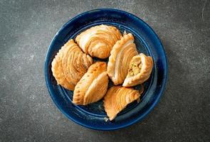 curry puff stuffed chicken on plate photo