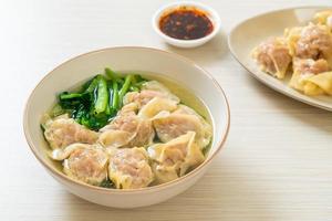 pork wonton soup or pork dumplings soup with vegetable photo