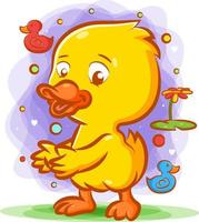 The duck dancing on the green grass with the happy face vector