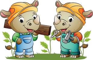 The cute two builder rhinos are holding the building tools and a wooden board vector