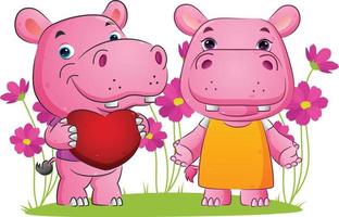 The couple of the sweet hippopotamus is holding a love and standing with the happy face vector