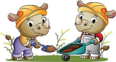 The couple builder rhino is digging the ground and move to the wheelbarrow vector