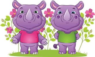 The couple of friendly rhino in the welcoming posing in the garden full of the flowers vector