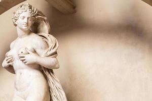 Sensual naked woman statue in Florence, Italy. Beauty figure made of stone.