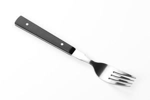 Beautiful dining fork isolated on a white background photo