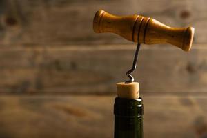 close up corkscrew with wooden background
