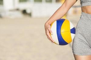 front view female volleyball player beach holding ball with copy space photo