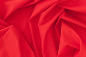 folded red textile fabric texture background photo