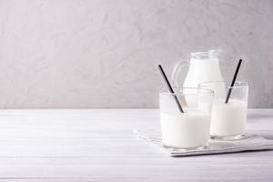 Glass serving vessels with milk. Healthy and dietary food, dairy products photo