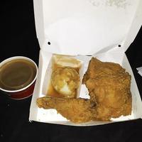 Fresh delicious crispy fried chicken golden brown with egg and corn on white box. photo