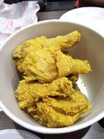 Fresh delicious crispy fried chicken golden brown on white box. photo