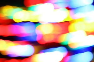 abstract many circle colorful urban realistic blurred glitter light colorful texture on black. photo