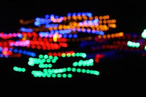 abstract circle line blue and green and orange urban realistic blurred glitter light colorful texture on black. photo