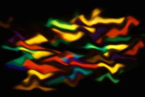 colorful abstract magic blur light texture rainbow reflective on black. photo