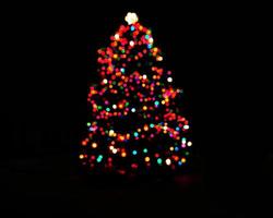 rainbow colorful blur christmas lights background.abstract Lights unfocused blur light dots black . photo