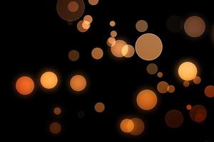 orange blur effect black background.abstract black unfocused blur light dots black . photo