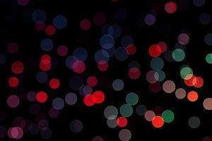 blue and red blur effect black background.abstract black unfocused blur light dots black . photo
