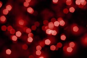 red and orange blur christmas black background.abstract black unfocused blur light dots black . photo