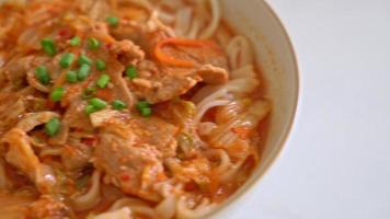 Korean udon ramen noodles with pork in kimchi soup - Asian food style video