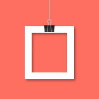 Paper photo frame hanging by binder clips on trendy living coral background. Retro vintage style mockup. Vector illustration. Easy to edit template with copy space for your picture or text.