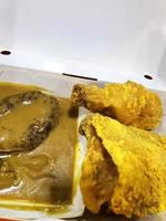 Fresh delicious crispy fried chicken golden brown with on white box. photo