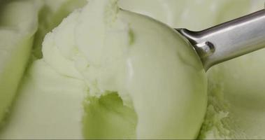 Close up, Slomotion, Chef scooping vanilla ice cream. Texture of vanilla ice cream. video