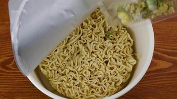 instant noodles with spices in a cup