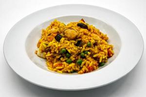 Traditional spanish Paella with seafood and chicken. photo