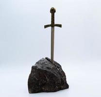 Excalibur, the mythical sword in the stone of King Arthur photo