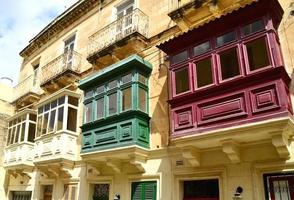 Traditional wooden colorful balconies in center of La Valletta. Malta photo
