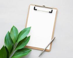 Clipboard and leaves photo