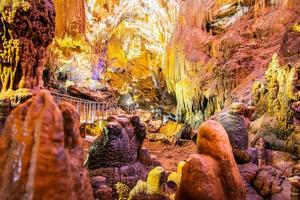 Stunning view inside Prometheus cave with no tourists and illiuminated geological formations