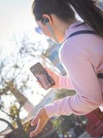 Girl chat through phone in public photo