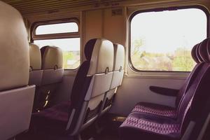 Empty seats in train wagon indoor photo