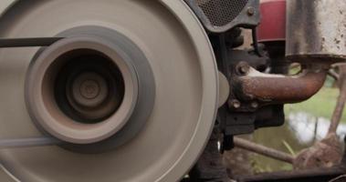 Close up, Belt rotation on the tractor engine. Spin around while the machine is running. video