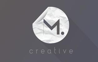 M Letter Logo with Crumpled And Torn Wrapping Paper Texture. vector