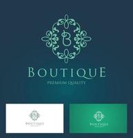 logotipo floral boutique vector