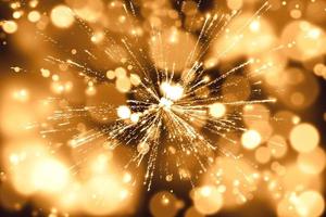 Abstract background. Gold-colored blur. Fireworks circle blur photo