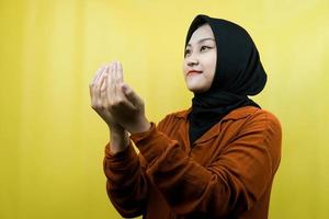 Beautiful asian young muslim woman praying, apologizing, sad, fasting ramadan, islam, isolated photo
